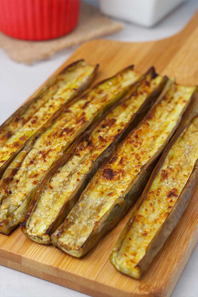 cooked zucchini sticks on a cutting board