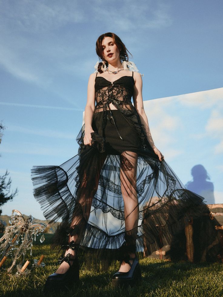 a woman in a black dress standing in the grass Cider Dresses, Gothic Chic, Floral Outfit, Clothing Details, Lace Hem, Lace Ruffle, Trendy Clothes For Women, Floral Midi Dress, Chest Pad