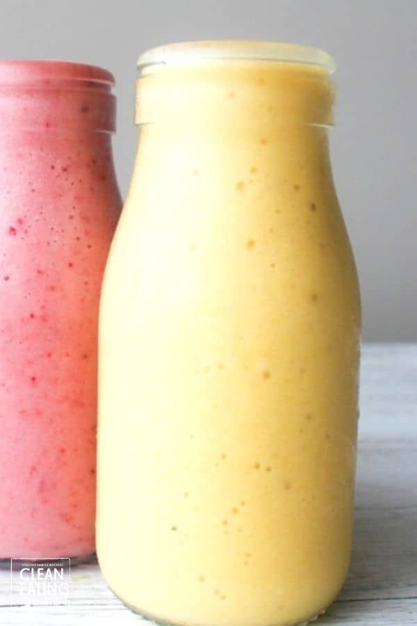 two smoothies sitting next to each other on a table