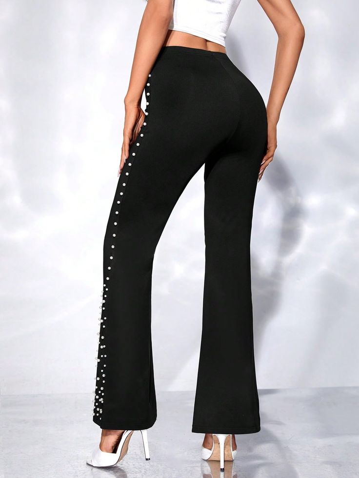 These Black Pearl Beaded High Waist Flare Pants are extremely comfortable and stylish, designed with high-quality vegan leather and unique beading detail. The high waisted design gives you a flattering figure and the perfect amount of coverage, making them a great choice for any occasion. Fabric Type: 90% Polyester, 10% Elastane Care Instructions: Hand Wash Only Closure Type: Pull On High Waist Rhinestone Bottoms For Night Out, High Waist Bottoms With Rhinestones For Night Out, Fitted High Waist Bottoms With Rhinestones, High Waist Pants With Rhinestones, High Waist Embellished Evening Bottoms, Embellished High Waist Evening Bottoms, Chic Evening Bottoms With Rhinestones, Embellished Straight Leg Bottoms For Night Out, Elegant Rhinestone Bottoms For Night Out