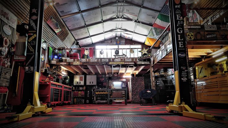 the inside of a garage with lots of tools and equipment on it's walls