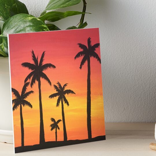 a painting of palm trees at sunset with the sun setting in the background art board print