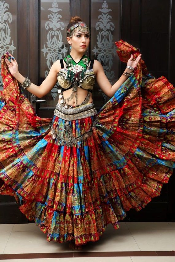 Bohemian Multicolor Skirt For Festivals, Multicolor Skirt For Festivals, Bohemian Tiered Skirt For Festive Occasions, Bohemian Tiered Skirt With Attached Cancan, Traditional Tiered Skirt With Attached Cancan, Festive Bohemian Cotton Skirt, Traditional Tiered Ruffle Skirt, Fitted Tiered Skirt For Festivals, Traditional Multicolor Skirt For Festival