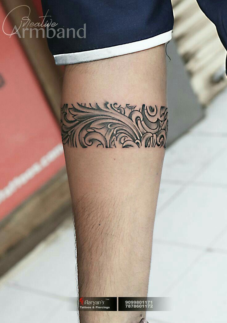 a man with a tattoo on his leg