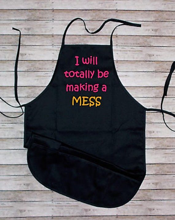 a black apron that says i will totally be making a mess on the front and back