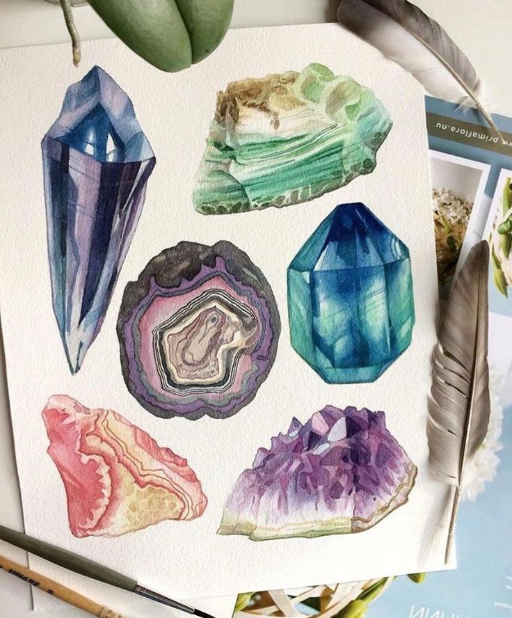 watercolor painting of crystals and feathers on paper