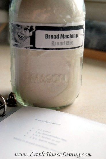 there is a jar with bread machine on it next to a notepad and scissors