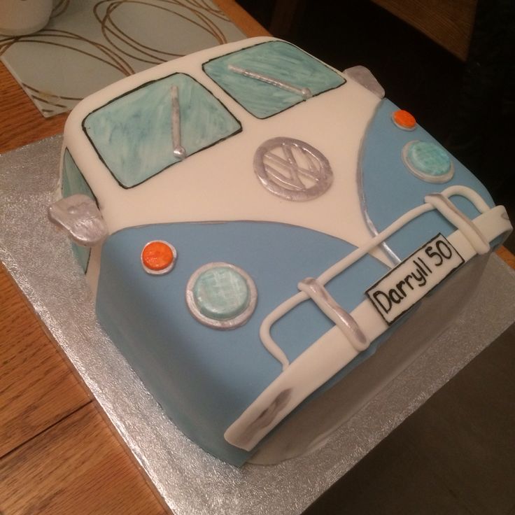 a blue and white cake with a vw bus on it