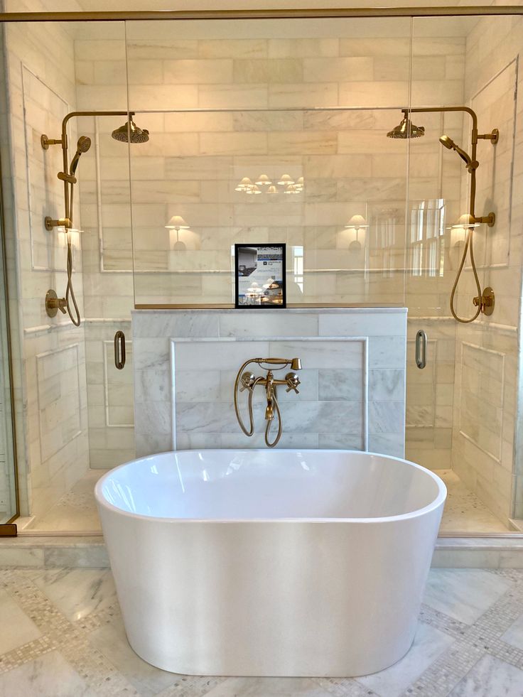 a large white bath tub sitting inside of a bathroom