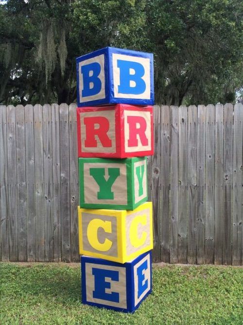 a stack of blocks that spell out the word bbrrr in front of a fence