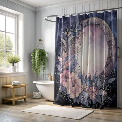 a bathroom with a bathtub, rug and shower curtain in the shape of a crescent