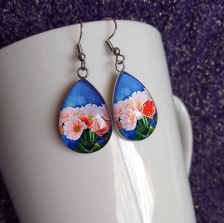 Vibrant Colorful Primrose Handmade Glass Earrings Artistic, bold statement earrings, a perfect gift and choice for artists and nature lovers for any occasion. Ideal gift for an artist. Measures 0.98 inches in length and 0.70 inches in width. Comes with First Class Free shipping. Colors may vary due to monitor and lighting differences. Artistic Multicolor Flower Earrings, Artistic Flower Shaped Ear Wire Jewelry, Artistic Flower-shaped Earrings With Ear Wire, Multicolor Teardrop Flower Earrings As Gift, Pink Teardrop Earrings For Gift, Artistic Pink Flower Jewelry, Artsy Drop Earrings As Gift, Artsy Drop Earrings For Gift, Multicolor Hypoallergenic Flower Earrings Gift