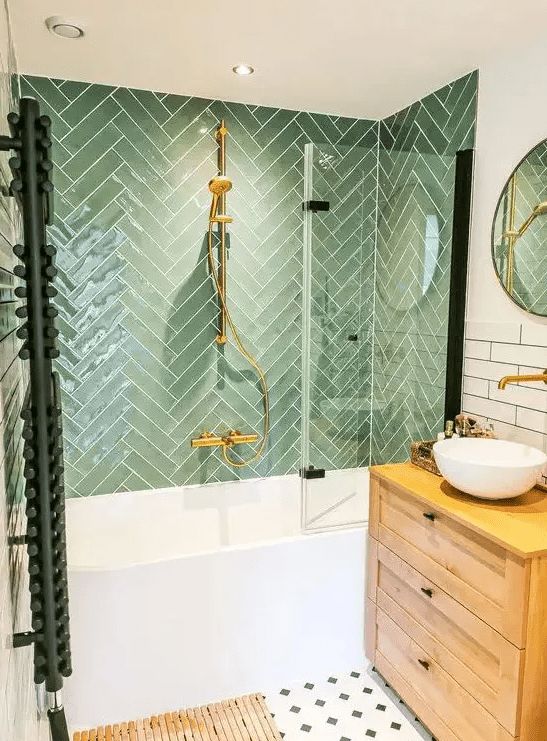 a bathroom with a sink, mirror and bathtub next to a wooden cabinet in the corner