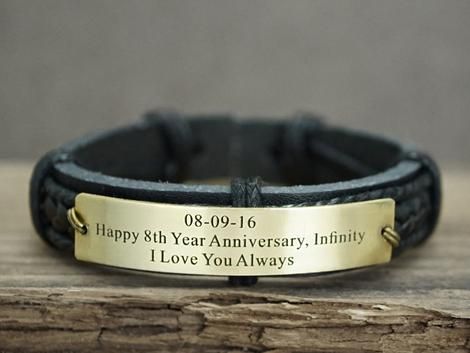 a black leather bracelet with a brass plate on it that says happy 8th year anniversary, infinity i love you always