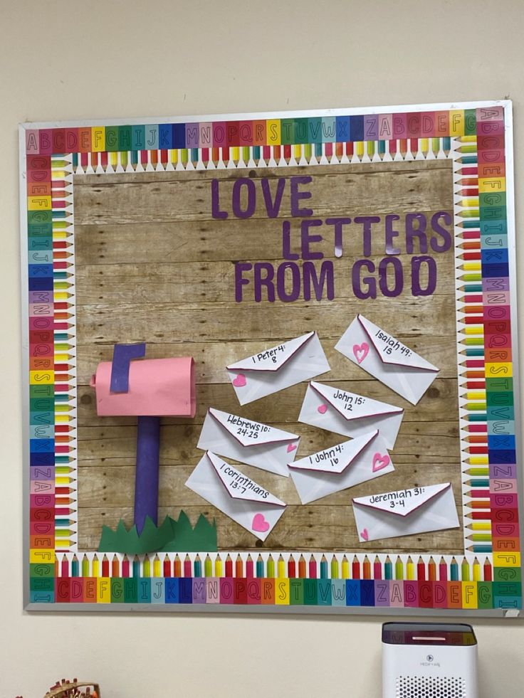 a bulletin board with letters and a hammer on it that says love letters from god