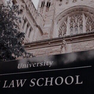 the law school sign is in front of an old building