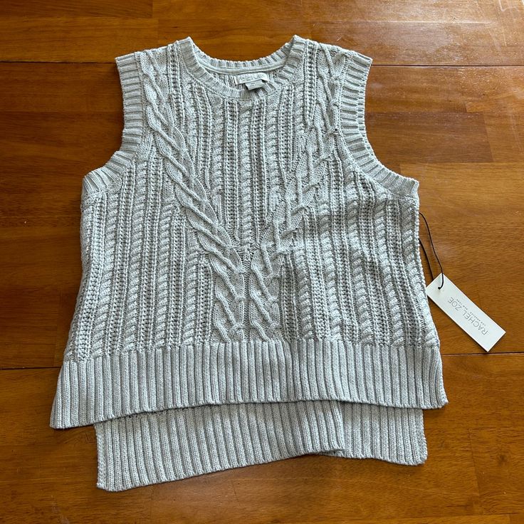 Stylish Gray Cable Knit Sleeveless Top. Perfect For Layering. Soft And Comfortable. Gray Knit Sleeveless Sweater Vest, Gray Sleeveless Fall Tank Top, Gray Sleeveless Tank Top For Fall, Gray Tank Top For Fall, Casual Sleeveless Sweater For Layering, Spring Cable Knit Sleeveless Sweater Vest, Cozy Knit Sweater Vest For Spring, Spring Sleeveless Cable Knit Sweater Vest, Casual Knitted Tank Top For Layering