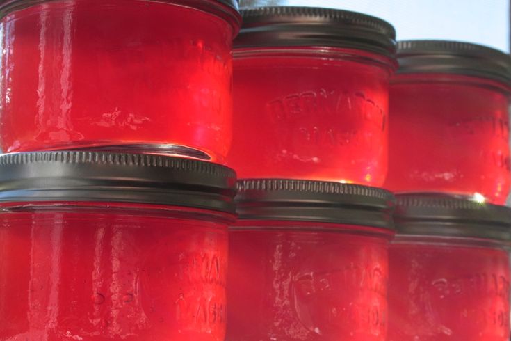 red jars are stacked on top of each other