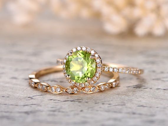 Ring Information---- Main Stone : *7mm Round Cut Peridot Side Stone: * Round Cut SI-H Diamonds * Approx weight: 0.21ct Metal: * Solid 14K yellow gold If you would like to purchase the peridot ring only,please check this link: Peridot Engagement Rings Gold, Wedding Jewelry With Peridot In Halo Setting, Wedding Jewelry With Brilliant Cut Peridot, Wedding Jewelry With Prong Setting And Peridot, Wedding Jewelry With Prong Set Peridot, Wedding Jewelry With Peridot In Prong Setting, Round Cut Peridot Wedding Jewelry, Green Peridot Diamond Wedding Ring, Wedding Peridot Jewelry Round Cut