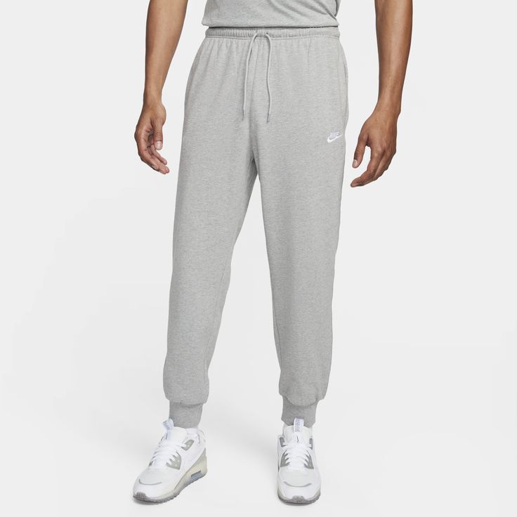 East to style and comfortable to wear, our Nike Club knit joggers are ready to become a versatile piece of your casual wardrobe. The relaxed fit is designed to give you a bit of room through the seat and thighs. The slight taper and ribbed ankle cuffs keep it clean around your sneakers. Pull them on with a tee or your favorite hoodie for casual, everyday wear. Knit Joggers, Club Fits, Training Pants, Heather White, Ankle Cuffs, Men's Knit, Look Casual, Bottom Clothes, Casual Everyday