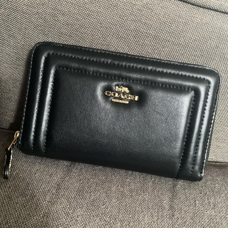 Coach Leather Black Wallet With Gold Accents. Never Used. Coach Black Wallets With Card Slots, Black Coach Wallets With Card Slots, Coach Black Evening Wallet, Coach Leather Clutch With Card Slots, Chic Coach Wallet With Zipper Closure, Chic Coach Bifold Wallet, Formal Black Wallet With Zipper Closure, Formal Black Coach Wallet, Coach Black Leather Wallet