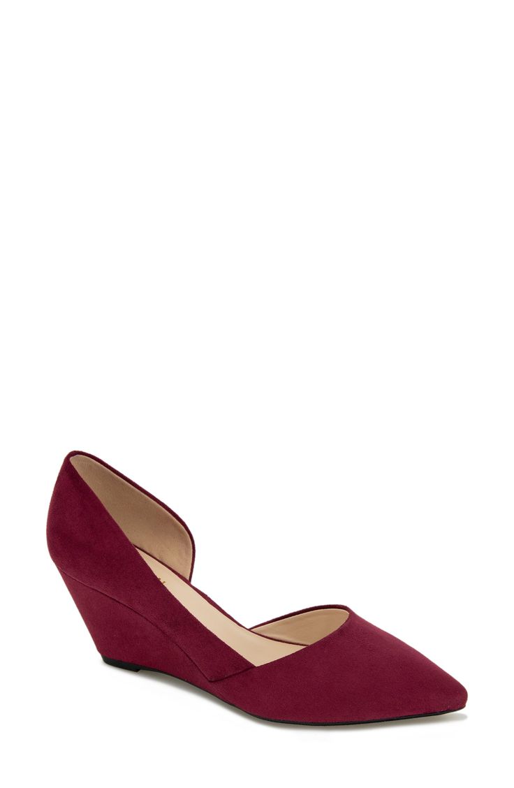 A pointed-toe pump offers chic style with a half d'Orsay silhouette lifted by a wrapped wedge heel. 2 1/2" heel Cushioned footbed Synthetic upper and lining/rubber sole Imported Burgundy Almond Toe Boots Medium Width, Burgundy Heels With 4-inch Heel For Office, Red 4-inch Heel Court Shoes For Office, Red 4-inch Heel Kitten Heels For Formal Occasions, Synthetic Pointed Toe Wedge Sandals With 4-inch Heel, Wedge Pump, Wedge Pumps, Kenneth Cole Reaction, Kenneth Cole