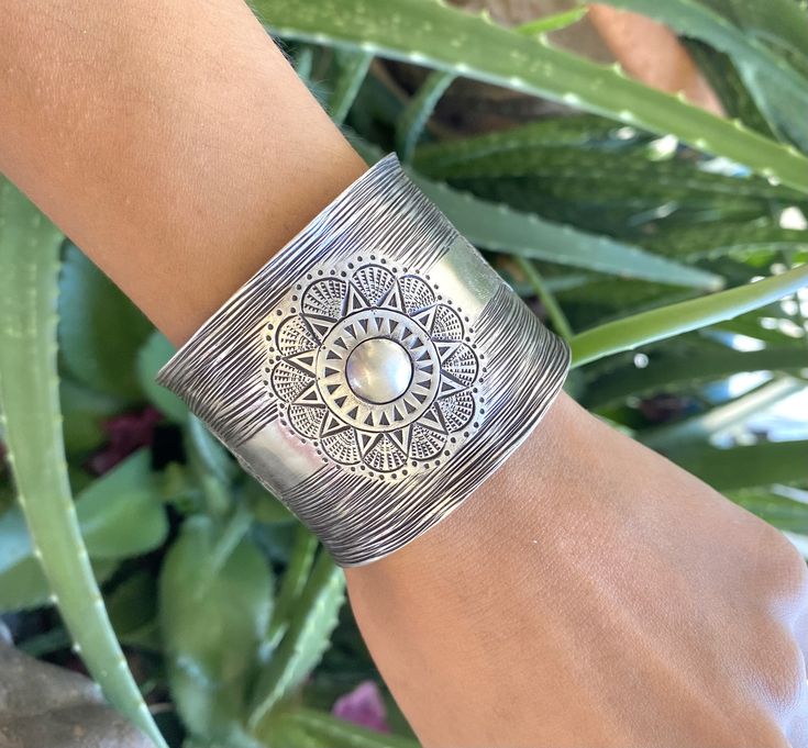 "❋ Handmade Sterling Silver Wide Boho Statement Cuff with Engraved Oxidized Silver Solar Mandala ❋ Dimensions: Width: About 1.5\" (3.8 cm), Length: About 6.9\" / 17.5cm ❋ Metal Purity: 95% Pure Silver (Purer than 925 Sterling Silver) To browse some more of our Silver Jewelry collection you can click on the following links: https://www.etsy.com/shop/SilverShapes Earrings: https://www.etsy.com/shop/SilverShapes?section_id=14809462&ref=shopsection_leftnav_1 Rings: https://www.etsy.com/shop/Silv Hippie Bracelet, Statement Cuff Bracelet, Hippie Bracelets, Handmade Flowers Paper, Fabric Purses, Bracelet Cuff, Sterling Silver Cuff, Oxidized Silver, Silver Cuff Bracelet