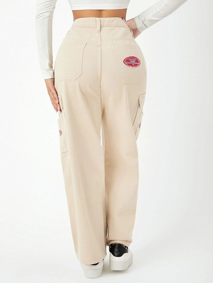 Unveil your fashion flair with our High Waist Pocket Side Wide Jeans. These cargo pants showcase a high waistline and a loose fit, creating a trendy and comfortable ensemble. The non-stretch denim fabric offers durability, while the zipper fly closure ensures easy wear. With a distinctive letter pattern and practical pockets, these tapered jeans are a versatile addition to your wardrobe. Details: Pattern Type: Letter Type: Tapered/Carrot Jeans Style: Cargo Pants Closure Type: Zipper Fly Waist Li Trendy Spring Cargo Jeans, Trendy Spring Cargo Jeans With Pockets, Mid-rise Beige Cotton Cargo Jeans, Beige Straight Leg Cargo Jeans For Streetwear, Trendy Full-length Cargo Pants With Patch Pockets, Beige Cargo Jeans With Side Pockets, Trendy Streetwear Pants With Patch Pockets, High Waist Cargo Jeans For Spring Streetwear, Trendy Straight Leg Cargo Pants With Patch Pockets