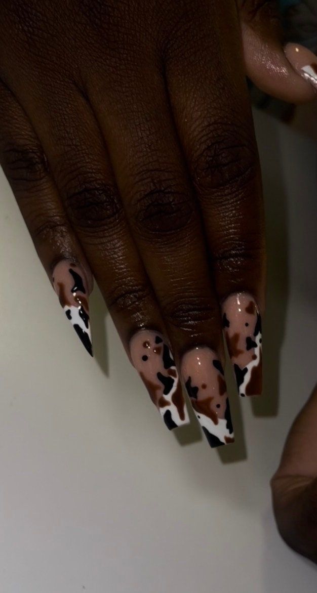 Cow print designed press-on nails. (Long Coffin in photo) Western Long Nails, Cow Print Press On Nails, Short Square Cow Print Nails, Blue Cow Print Nail Ideas, Cow Print Fall Nails, Texas Themed Nails, Cowhide Nails, Nail Ideas Country, Brown Cow Nails