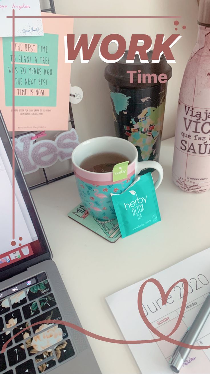 a laptop computer sitting on top of a desk next to a cup of coffee and other items