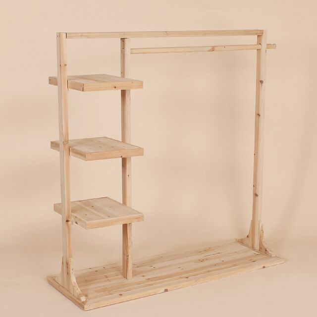 a wooden shelving unit with three shelves