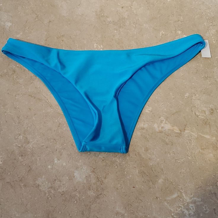 Solid Bikini Bottoms Mix And Match Perfectly For Versatile Beach Style Sky Blue With A Sheen. Fully Lined Size: Us 6 Nylon/ Elastane Blend Nwot Blue Swimwear For Sunbathing, Blue Stretch Tankini For Sunbathing, Blue Stretch Swimwear For Pool, Blue Stretch Beachy Swimwear, Stretch Blue Tankini For Sunbathing, Blue Seamless Beachwear Swimwear, Blue Seamless Triangle Top Swimwear, Stretch Turquoise Swimwear For Pool, Blue Seamless Tie-side Bottoms