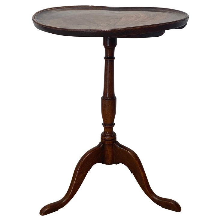 a small wooden table with two legs and a circular top on an oval pedestal,