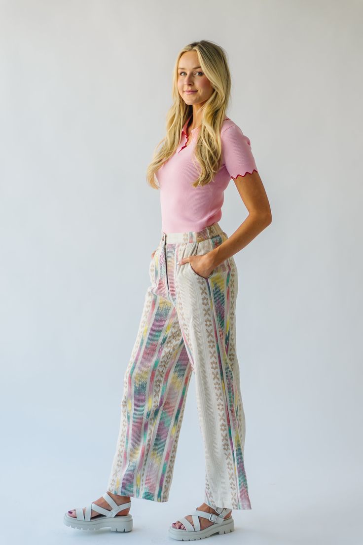 Introducing the Feia Embroidered Pant, perfect for adding some quirky style to your wardrobe. With colorful embroidery and a cream base, these pants are sure to make a statement. Step out in style while staying comfortable and unique. Details self: 61% acrylic + 22% polyester + 17% viscose lining: 100% cotton Fabric Care Guide Here Sizing & Fit Measurements are approximate and taken while laying flat across the front. Not doubled. small: waist = 15"; length = 42" ; inseam= 30" medium: waist = 15 Trendy Floral Embroidered Wide Leg Bottoms, Trendy Wide Leg Bottoms With Floral Embroidery, Bohemian Embroidered Beige Bottoms, Beige Bohemian Embroidered Bottoms, Casual Embroidered Beige Bottoms, Cream Cotton Wide Leg Ankle-length Pants, Casual Embroidered Pants For Loungewear, Cream Cotton Wide Leg Pants For Spring, Trendy Straight Leg Pants With Floral Embroidery