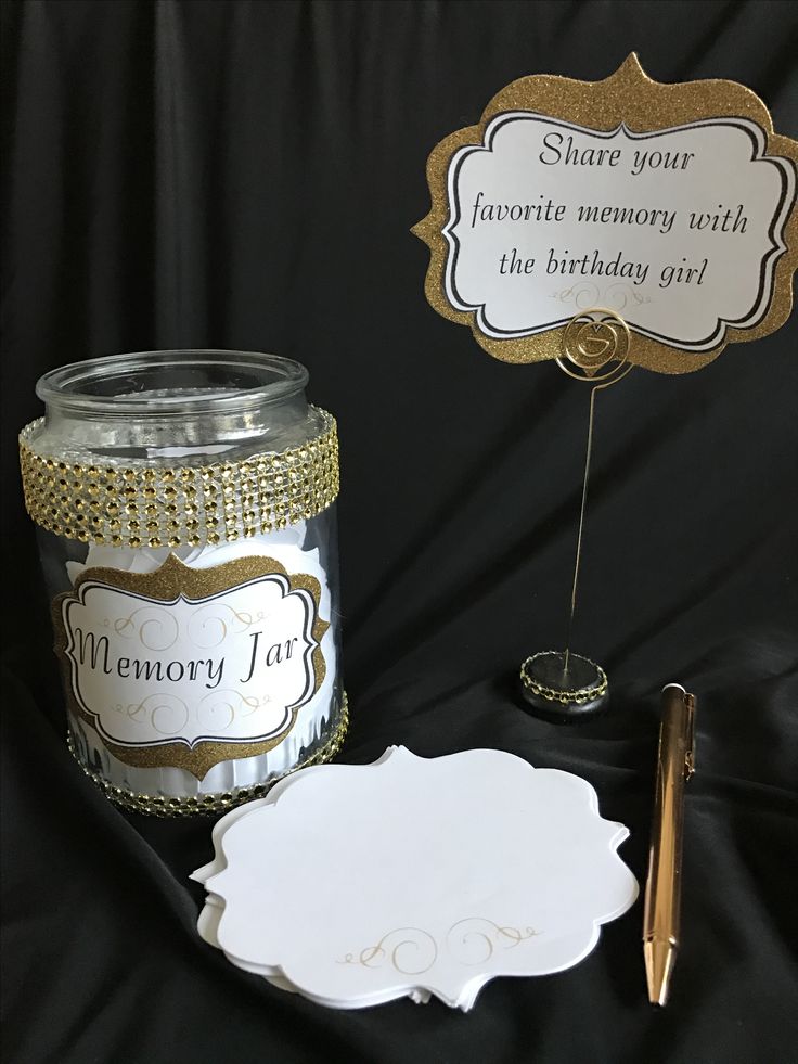 there is a jar with some cards and a pen next to it