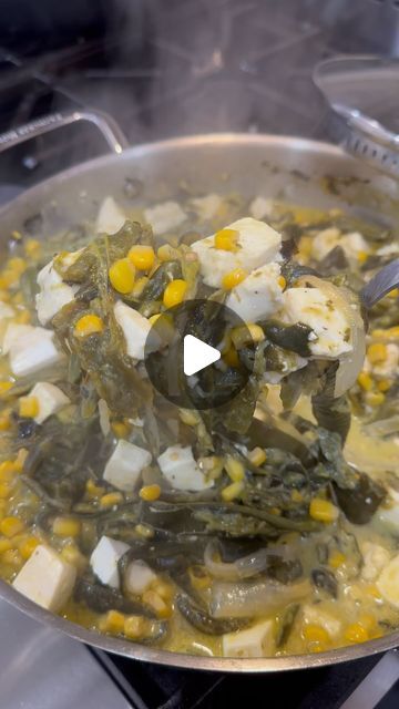 a pan filled with food on top of a stove