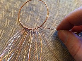 a person is working on some kind of wire art project that they are doing with