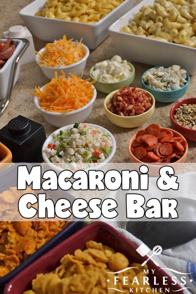 macaroni and cheese bar with different types of food in bowls on the counter