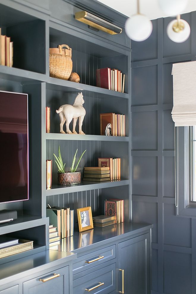 an entertainment center with bookshelves and shelves