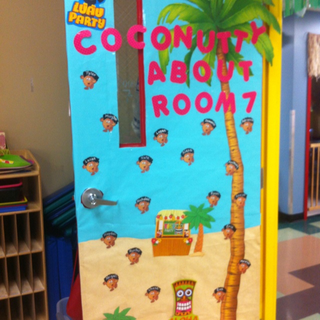 a classroom door decorated to look like a coconut tree and beach scene with words that read, county about room 7