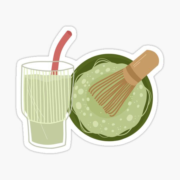 a green drink with a whisk in it next to an avocado sticker