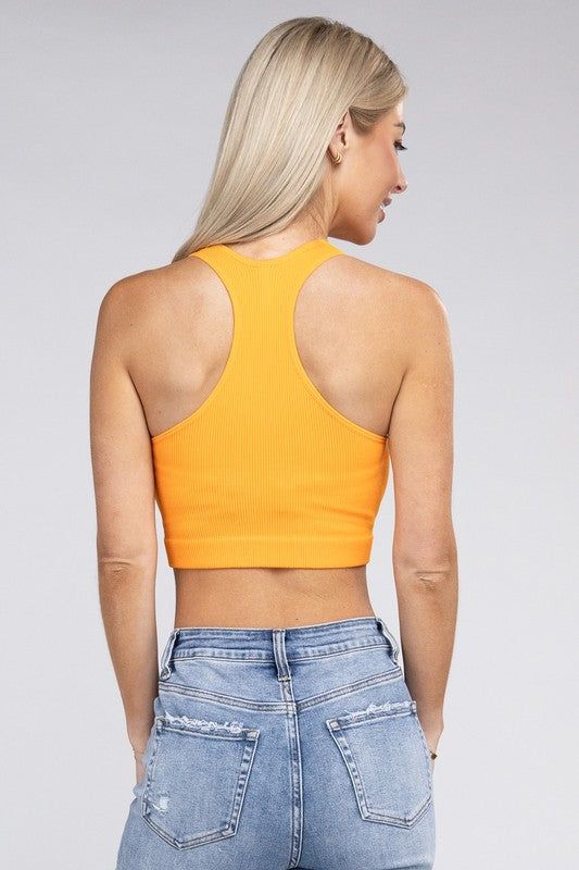 The Ribbed Cropped Racerback Tank Top is a versatile and stylish addition to your wardrobe. Made from a ribbed fabric, it offers a comfortable and stretchy fit that complements various body types. The racerback design adds a sporty and trendy touch, making it suitable for both casual and athletic wear. *Color may vary slightly due to monitor resolutionModel is wearing a Small Model SpecsHeight: 5'8"Bust: 34D Waist: 24"Hips: 37"Made in China Style: Sporty Print / Pattern: Solid Silhouette: Racerb Solid Ribbed Stretch Crop Top, Ribbed Stretch Crop Top, Stretch Ribbed Crop Top, Stretch Ribbed Solid Color Crop Top, Solid Color Stretch Ribbed Crop Top, Trendy High Stretch Racerback Crop Top, Trendy Seamless Racerback Crop Top, Trendy Ribbed Crop Top With Racerback, Ribbed Crop Top For Workout In Spring