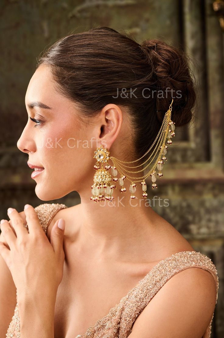 Elevate your style with our stunning kundan-encrusted jhumka earrings, expertly highlighted with soft mint fluorite stones. Paired with a sleek and stylish kaan chain, this traditional yet trendy piece is sure to make a statement. Perfect for special occasions or everyday elegance, it adds a touch of classic sophistication to any outfit." Closure - Push Back  Weight - 117gm Traditional Drape Wedding Jewelry With Latkans, Diwali Tikka With Latkans For Reception, Diwali Reception Tikka With Latkans, Reception Chandbalis With Tilla Detail, Festive Reception Tikka With Latkans, Bridal Earrings With Latkans For Reception, Bridal Earrings With Latkans For Reception Festivals, Meenakari Danglers For Reception, Festive Bridal Earrings With Latkans For Reception