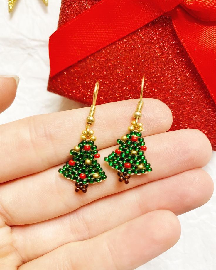 Cute tiny Christmas Tree earrings great for the holiday season! Made with Czech glass seed beads. Earring wire is Nickel-free | Mini Christmas Tree Earrings, Christmas Tree Earrings, Stocking Stuffers For Women, Christmas Jewelry, Holiday Gifts For Mom, Gifts Under 10 Felt Christmas Tree Earrings, Cheap Christmas Beaded Earrings For Women, Hama Bead Christmas Earrings, Mini Beaded Christmas Tree, Crochet Christmas Tree Earrings, Christmas Beading, Big Christmas Tree, Beading Designs, Crochet Jewellery