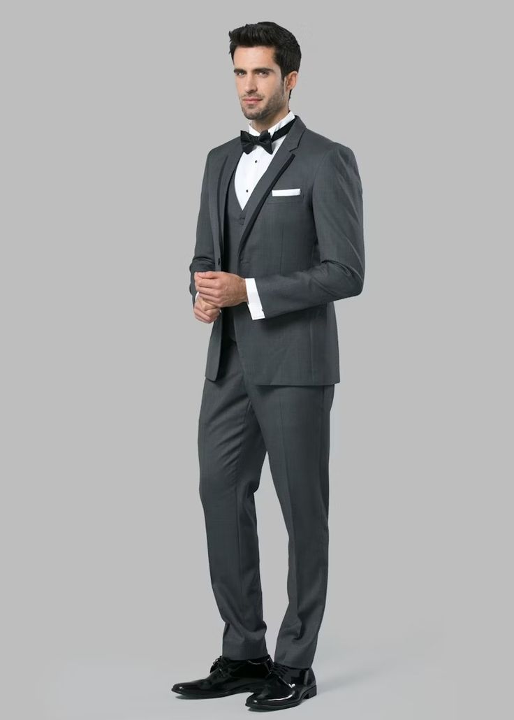 Charcoal Notch Lapel Tuxedo | Menguin | Charcoal Tuxedo Notch Lapel Tuxedo For Black Tie Events, Custom Fit Notch Lapel Tuxedo For Black Tie Events, Custom Fit Tuxedo With Notch Lapel, Dapper Notch Lapel Tuxedo For Formal Occasions, Gray Tuxedo Suit For Formal Occasions, Custom Fit Tuxedo With Notch Lapel And Pressed Crease, Custom Fit Tuxedo With Notch Lapel In Suiting Fabric, Classic Fitted Tuxedo For Groom, Fitted Classic Tuxedo For Groom