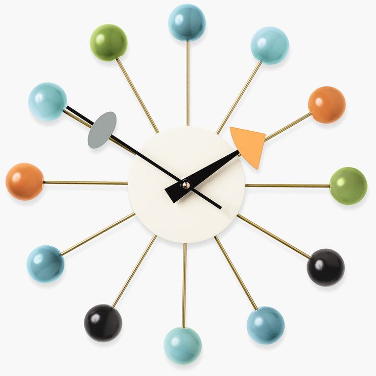 a clock with several different colored balls on it's face and the hands are pointing upward