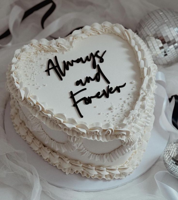 a white cake with black writing on it