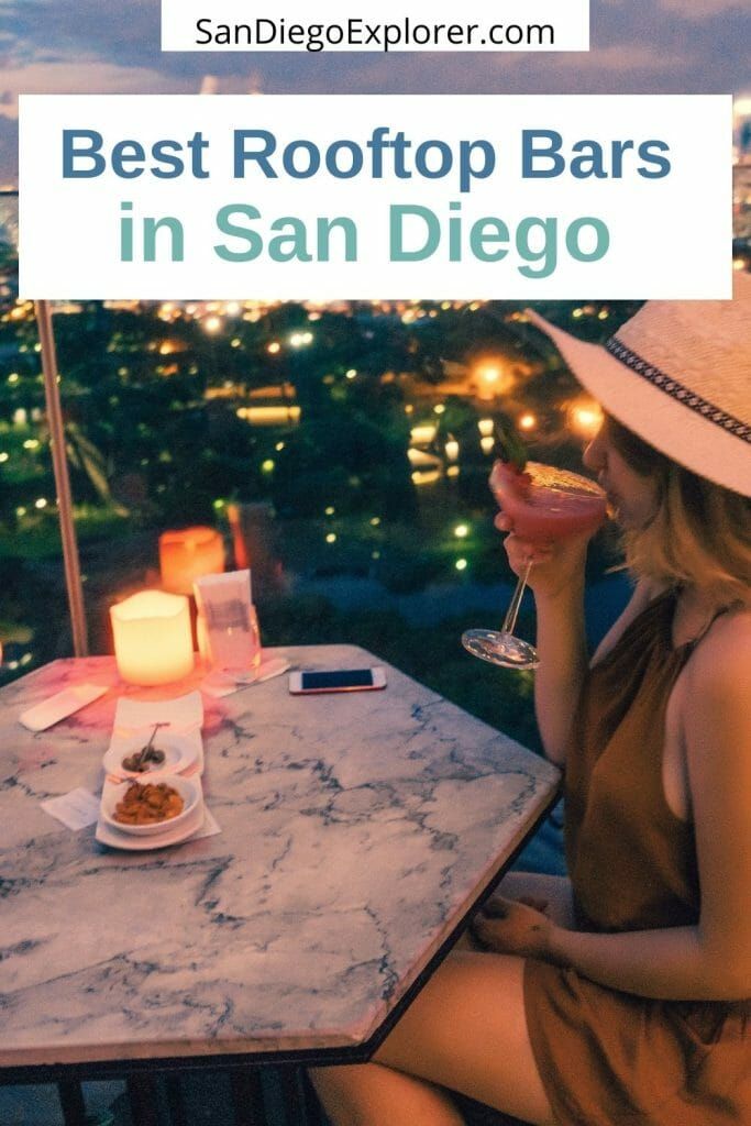 a woman sitting at a table with a drink in her hand and the words best rooftop bars in san diego