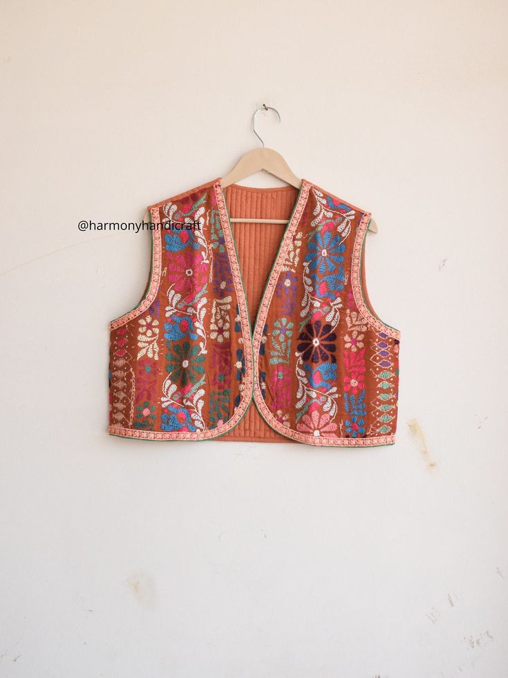 HARMONYHANDICRAFTCO presenting beautiful vintage banjara vest, It's reversible jacket which means you can wear this by both side.  Buy it for the holidays! Looks fabulous over a long silk tank dress or palazzo pants. Or wear it with jeans and boots. The design of the jacket is very unique and very rare. Indian culture and associated with grace and beauty. This Is A Gorgeous Piece Of Cotton Kantha Stitched jacket. Perfect Gifts For Your Beloved.. What Are You Waiting For? Add This Item To Cart, Buy Now And Surprise Your Loved Ones! Measurements Approx : L/XL Length - 18 Inches Chest - 42 Inches Shoulder - 16 Inches Fabric - 100% Cotton Banjara vest, banjara sleeveless jacket, quilted vest, quilted jacket,embroidery vest, Indian kantha jacket, Kantha waistcoat, Reversible kantha jacket boho Vest Handmade, Silk Tank Dress, Boho Vest, Kantha Jacket, Boho Jacket, Indian Culture, Reversible Jacket, Kantha Stitch, Sleeveless Jacket