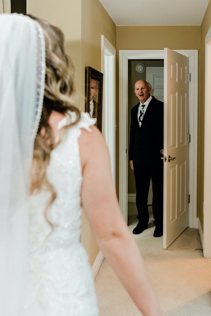 a man in a suit and tie standing next to a woman in a wedding dress